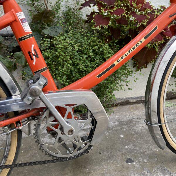Peugeot NS Orange Vélo en dépot-vente Les Mains Dans Le Guidon