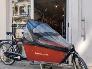Vélo Cargo Bakfiets pour enfants ou chiens avec protège pluie Vélo occasion Les Mains Dans Le Guidon